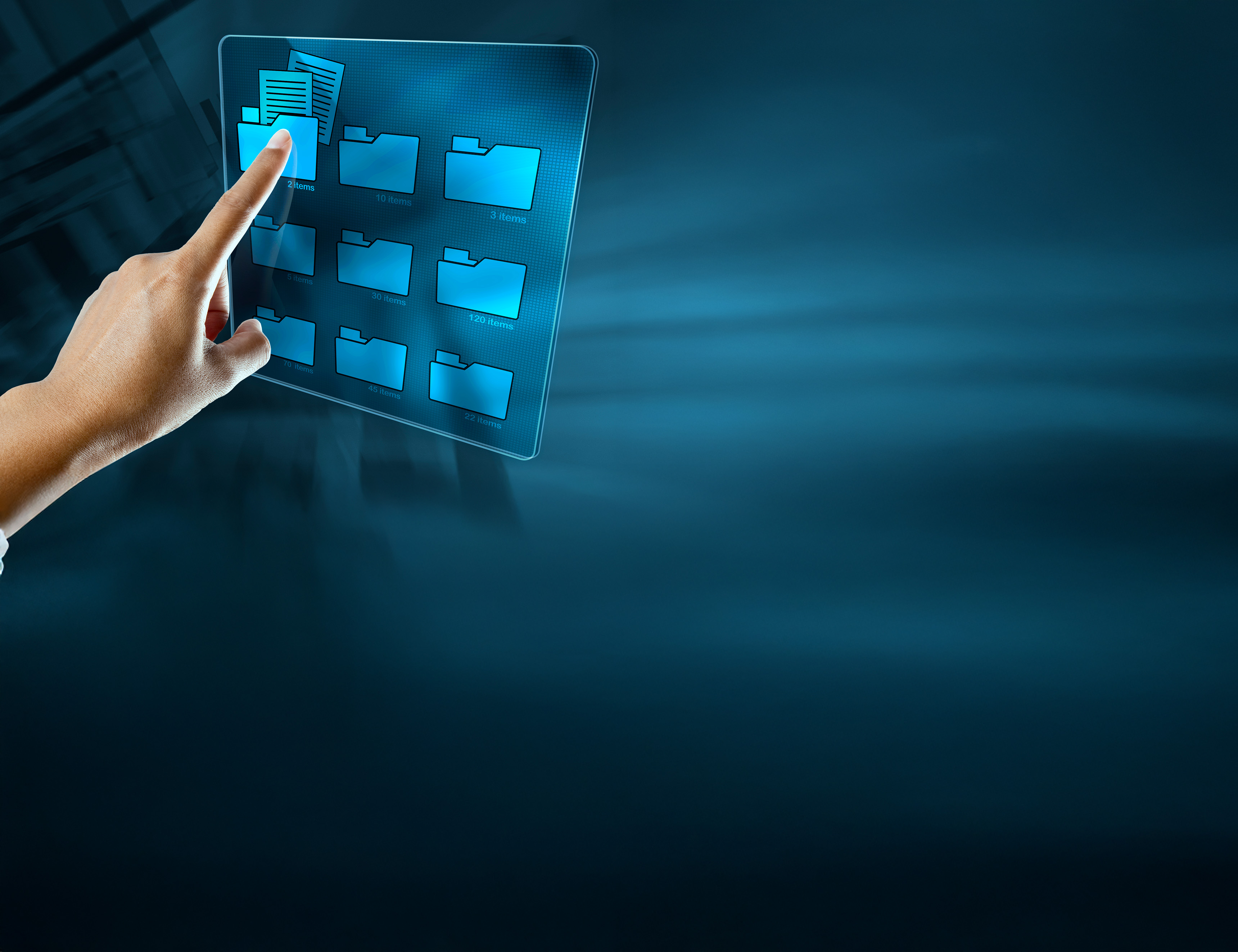 a finger pointing at a touchscreen