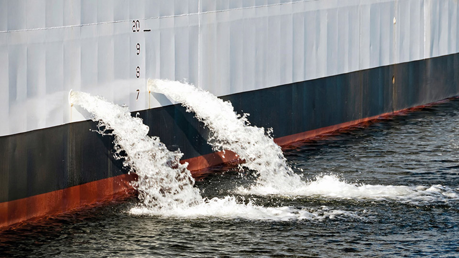 Ballast water pouring from ship